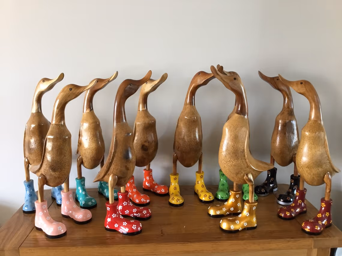 Hand-carved duck ornament on shelf